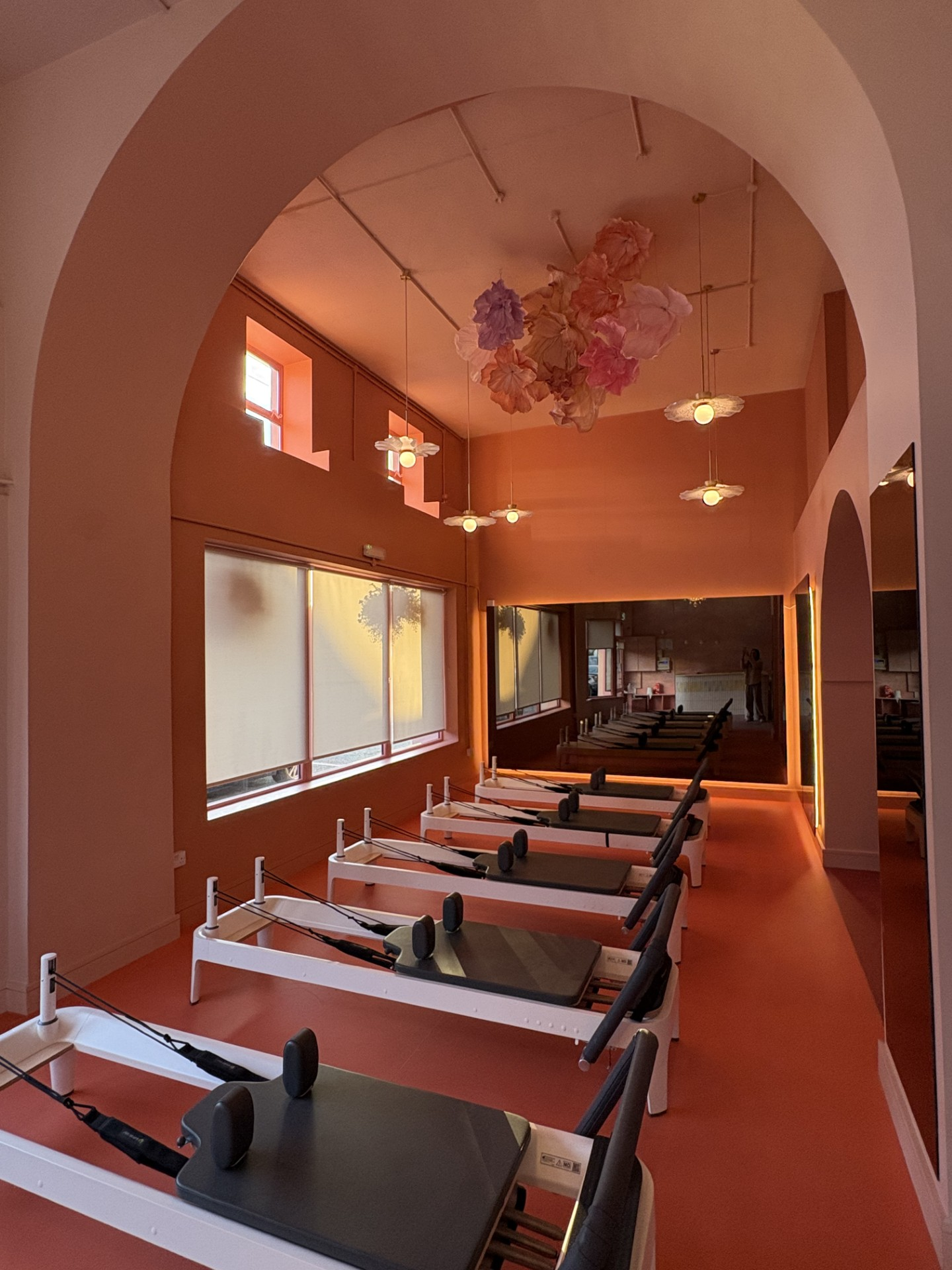 Øra reformer room with paper flowers across the ceiling