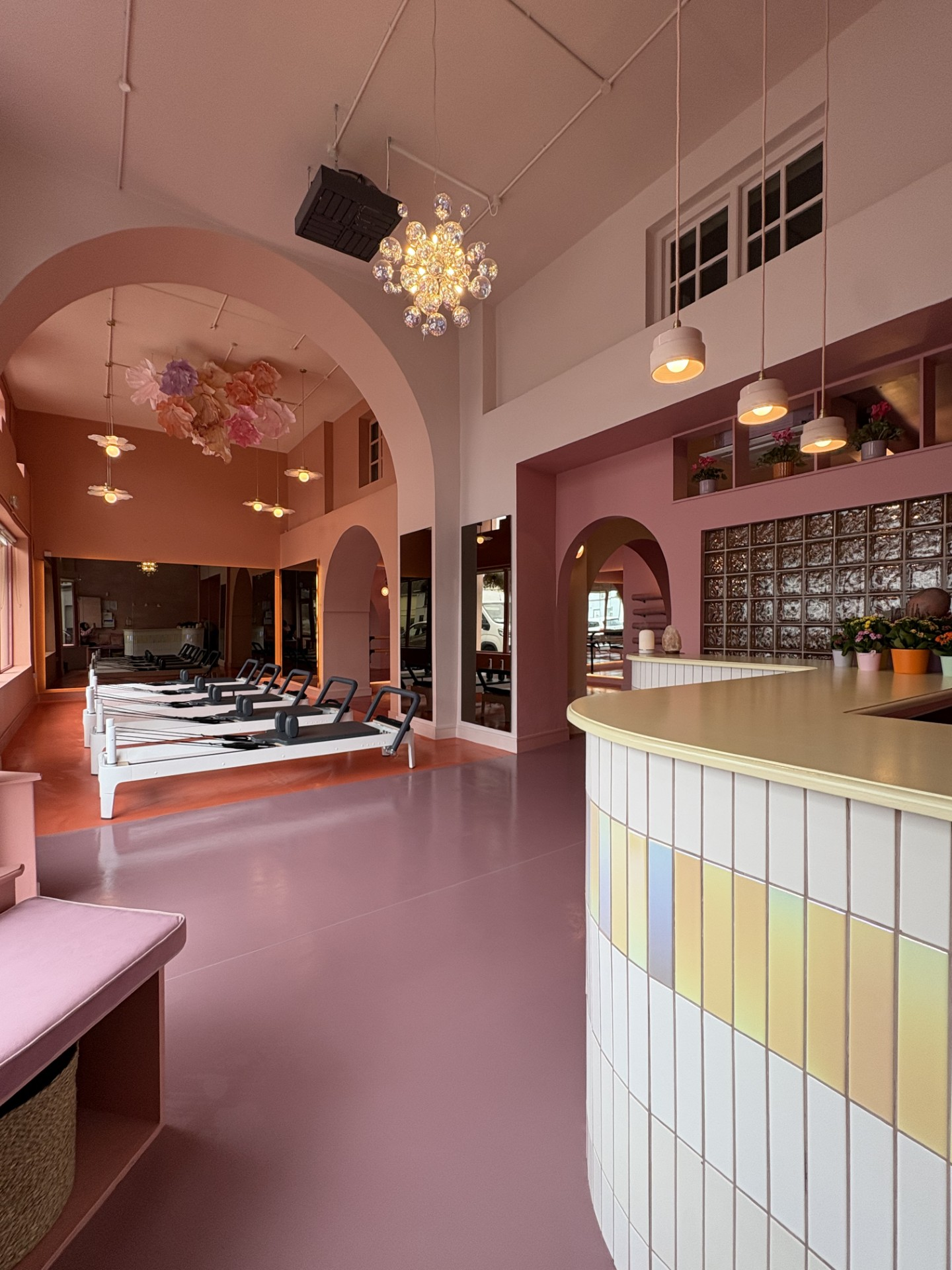 Øra reformer studio beneath softly lit arches